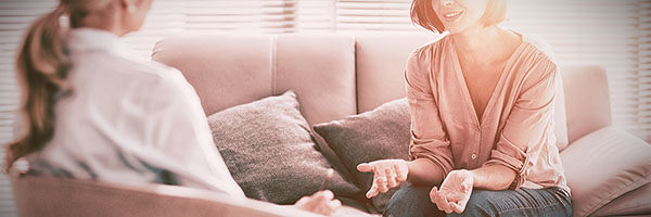 woman in psychologist treatment with woman pscyhologist